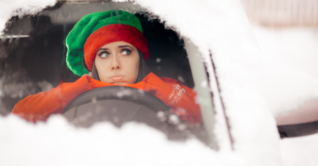 Showing a woman in holiday outfit driving in Atlanta during ice and snow storm. Common Accidents during the holidays in Atlanta! WHY DO ACCIDENTS INCREASE DURING THE HOLIDAYS!- Personal Injury Attorney in the Greater Atlanta area - The Law OFfices of Julie M Essa (1)